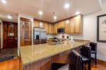 Large kitchen with granite countertops